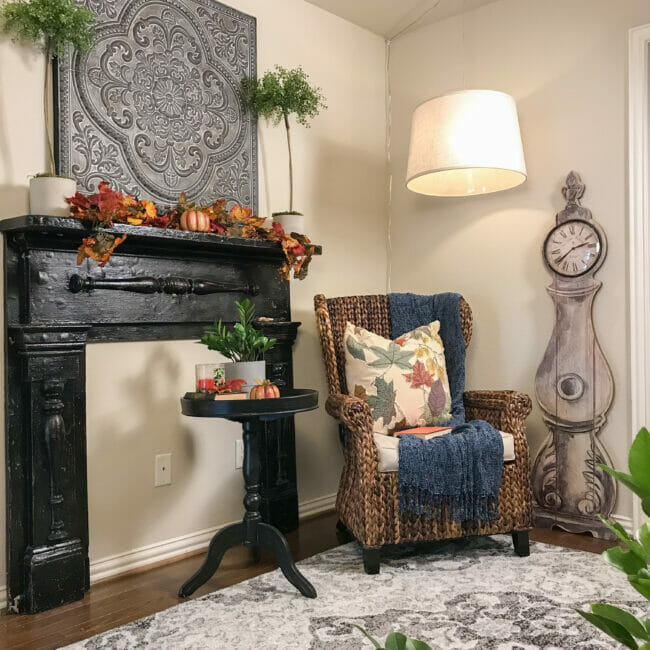 mantel with table, chair and clock