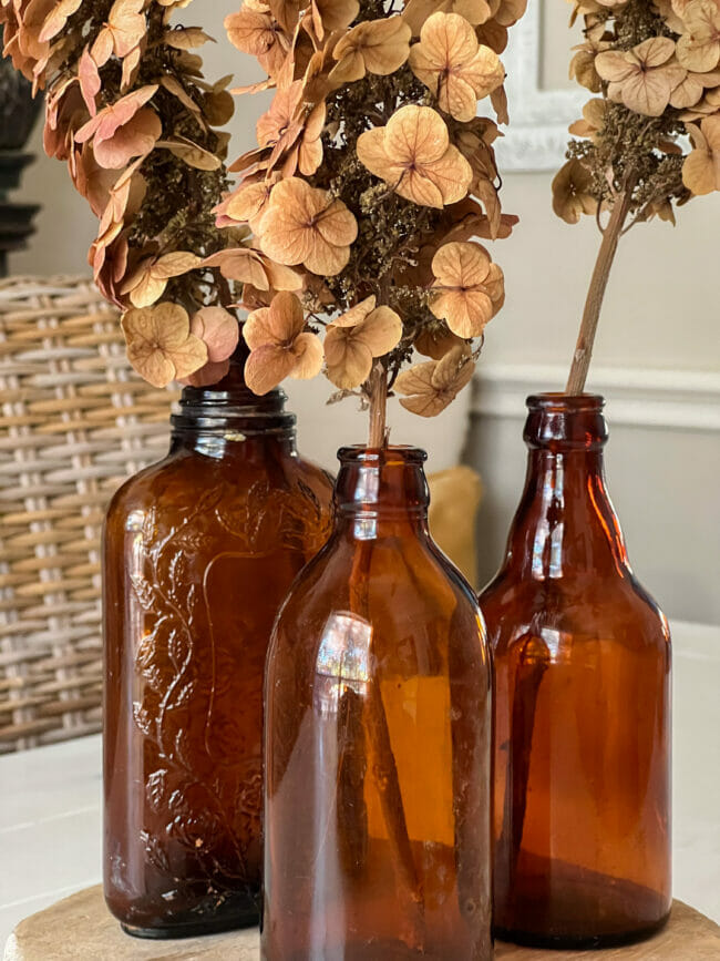 Decorating for Fall with Amber Glass Bottles with a Two-Tone Twist!