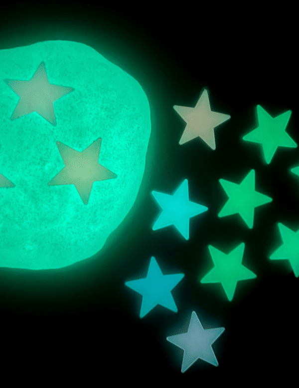 black background with glow in the dark stars and slime