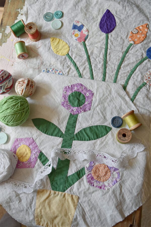 quilt squares with a purple and green flower