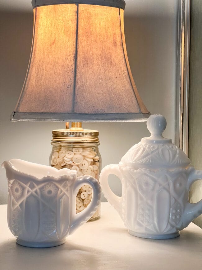 white button jar lamp with antique white milk glass creamer and sugar bowl