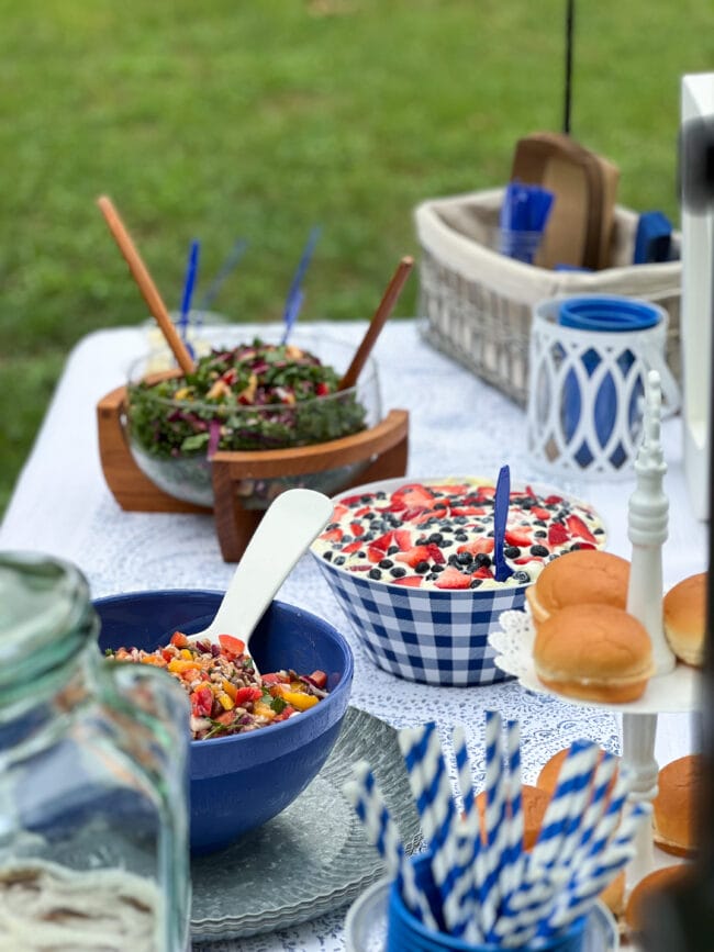 blue and white bowls with salads on a table