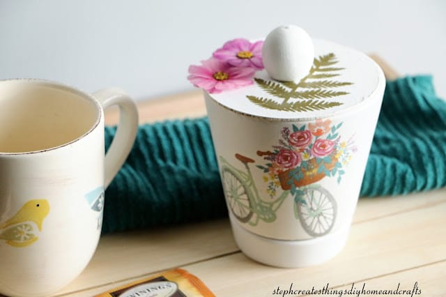 coffee cup with bird and a lidded pot with a bike and flowered decal
