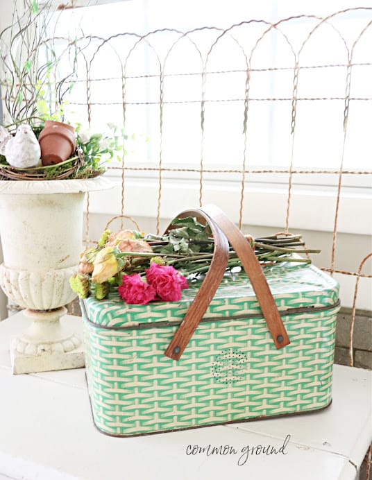 vintage green tin basket with roses on top