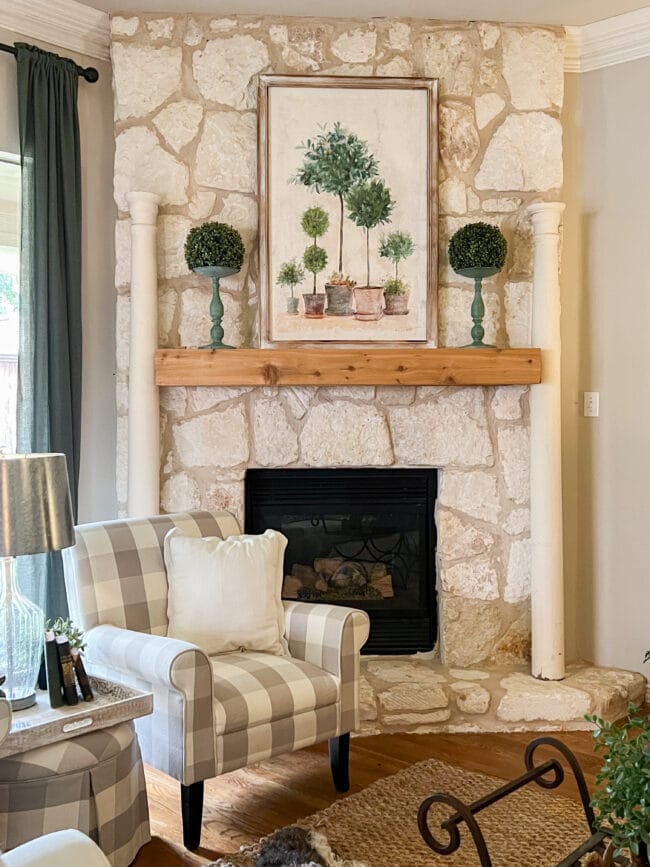 stone mantel with columns and topiary print and topiary balls