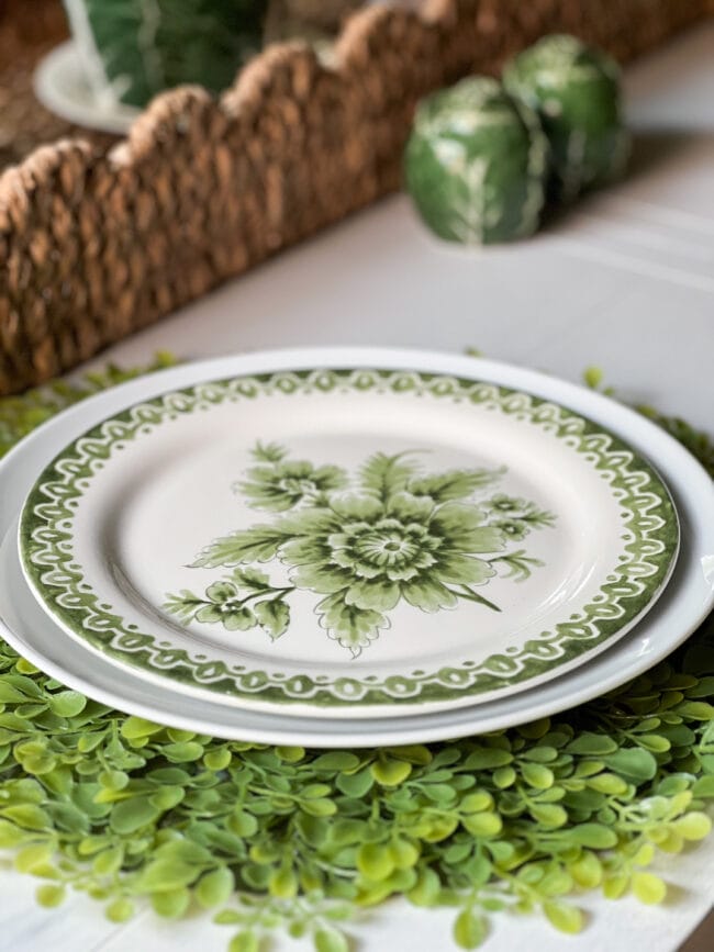 green and white salad plate with boxwood charger