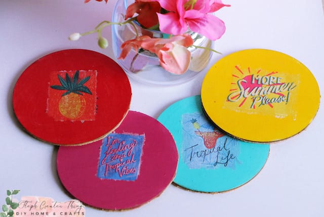 round coasters in red, maroon, blue and yellow with summer prints on top