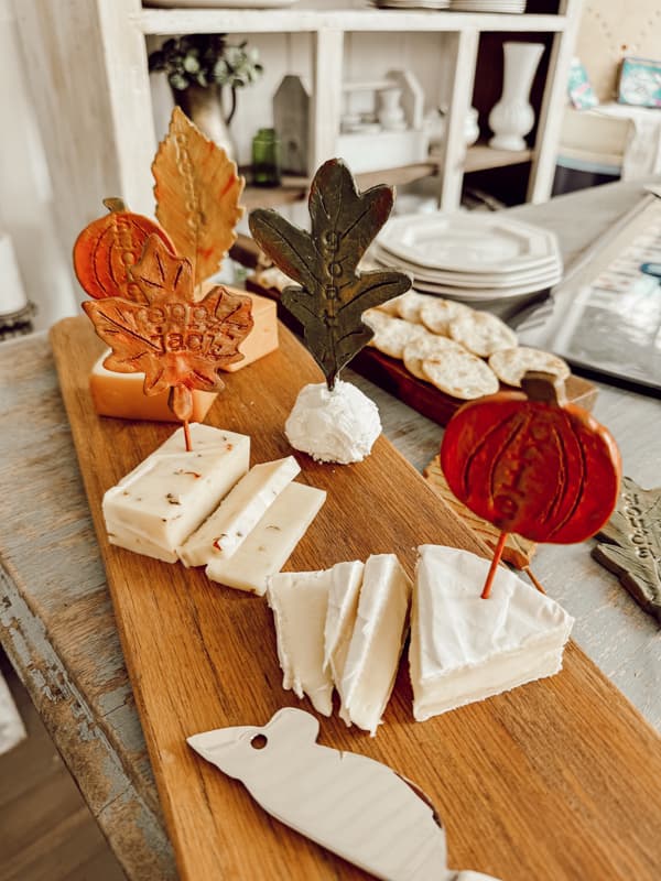 cheese board with homemade cheese markers in fall colors