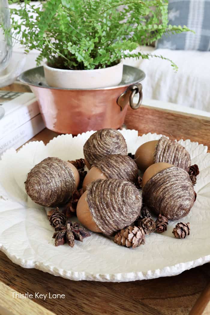 crafted acorns on a white leaf dish