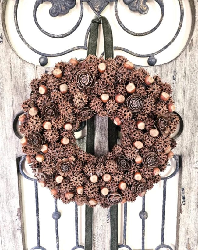 Sweet gum Tree ball wreath hanging on an iron piece