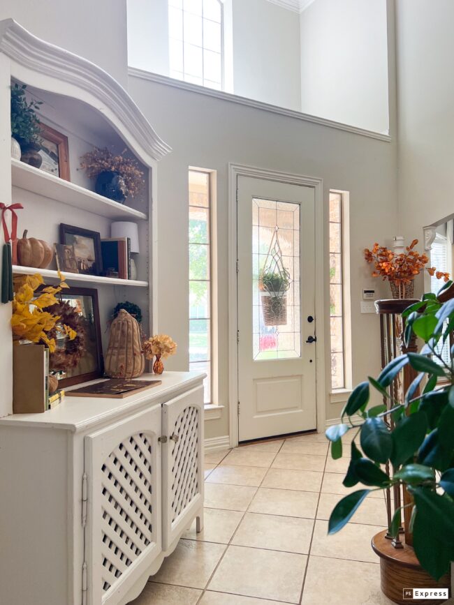 entry with white hutch and plant