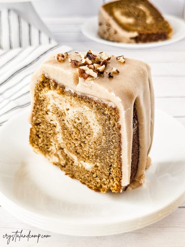 tall piece of pumpkin cheesecake pound cake in white plate