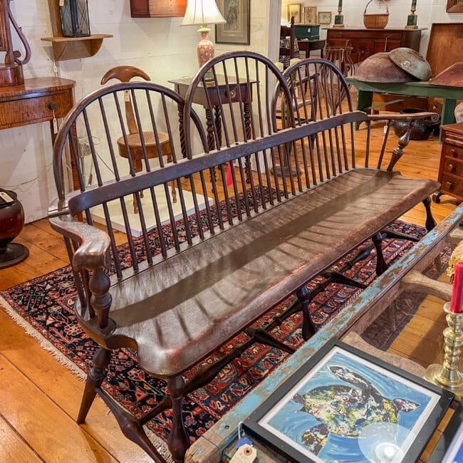 3 person antique bench with spindle back 