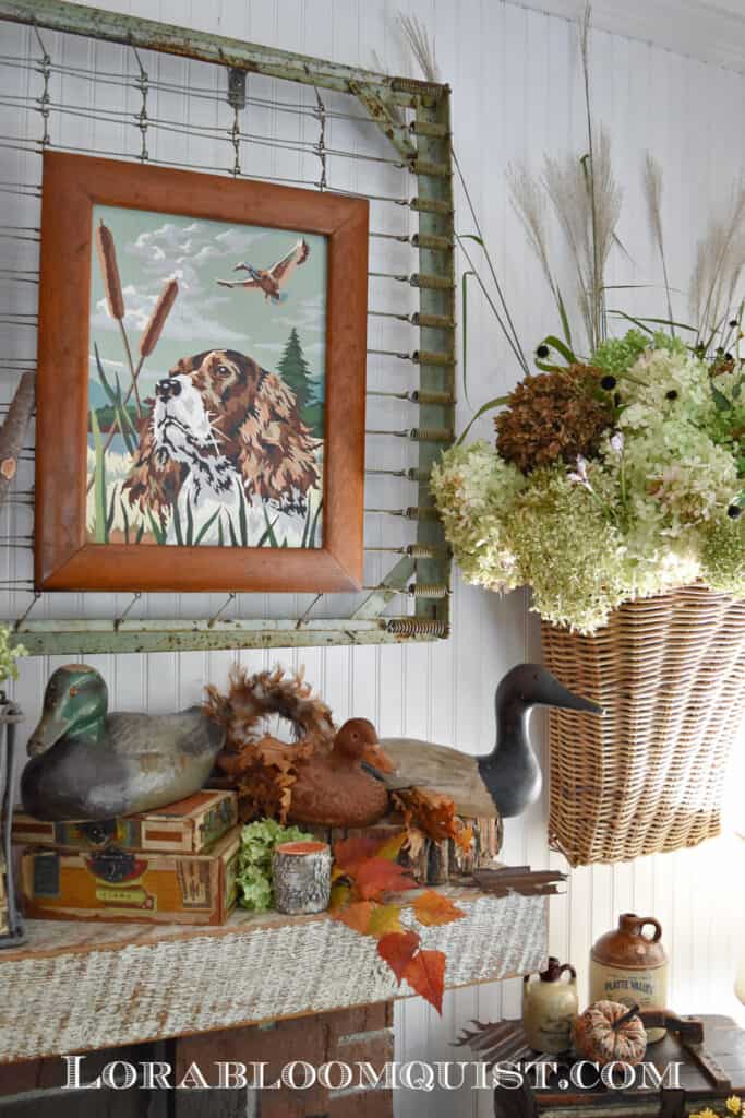 mantel with ducks, hydrangeas and fall florals