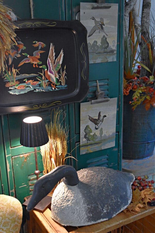 vintage bird pieces with lamp and blue walls