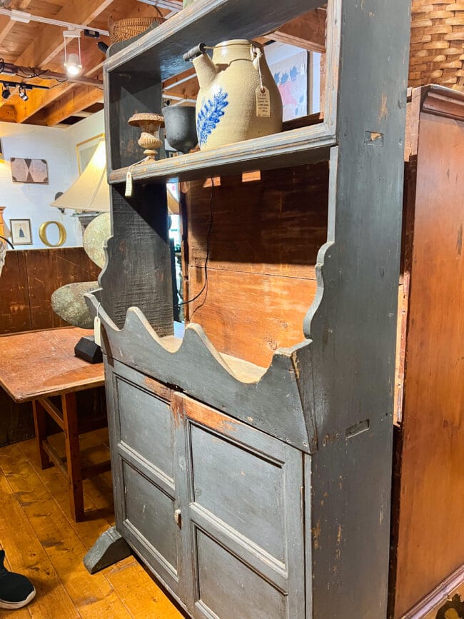 gray antique cabinet in an antique store in Maine