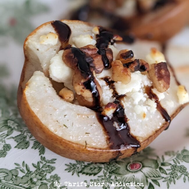 pear with chocolate syrup and nuts