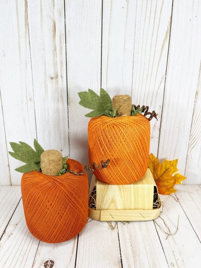 two orange bolts of string turned into pumpkins DIY