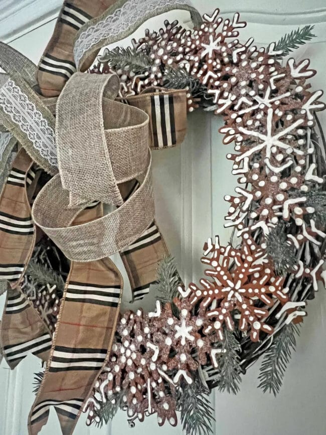 Faux gingerbread snowflake wreath with plaid ribbon