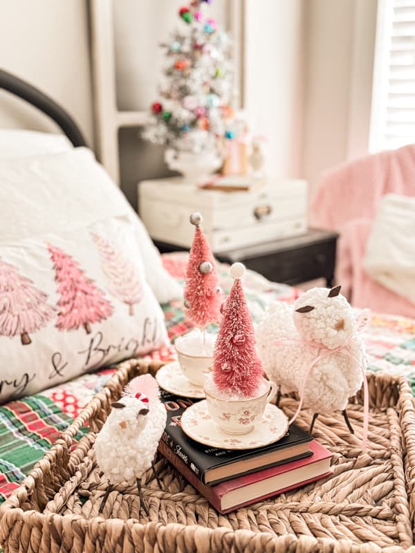 pink decorated bedroom with pink bottle brush trees, lamps and a tree pillow on top of the bed