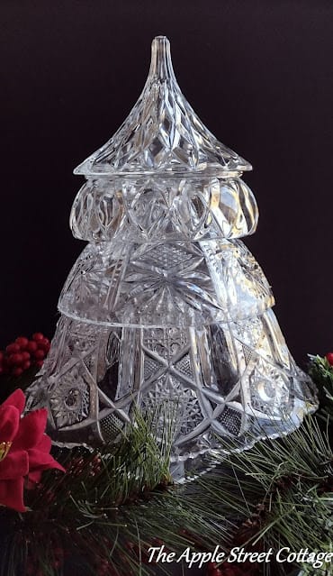 stacked glass bowls to make a Christmas tree on a black background