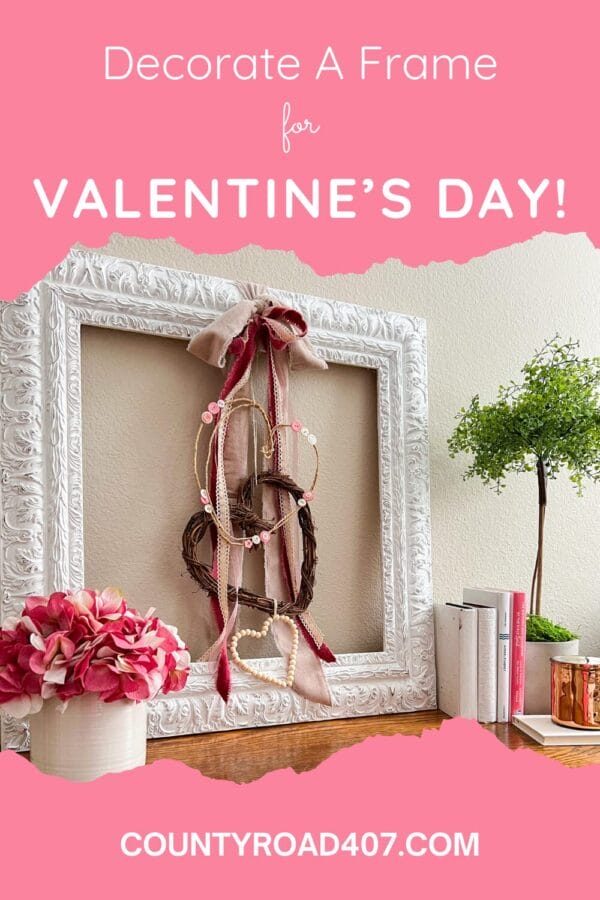 Pinterest graphic with photo of a Valentine's Day craft with pink ribbons and dangling hearts inside white frame