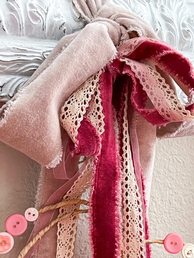 close up of several pink ribbons tied in a bow