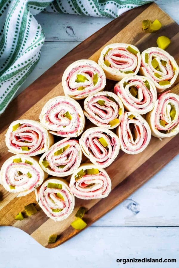 several rolls of salami tortilla roll ups for game day