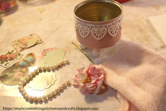 pink can with legs, pearls and flowers