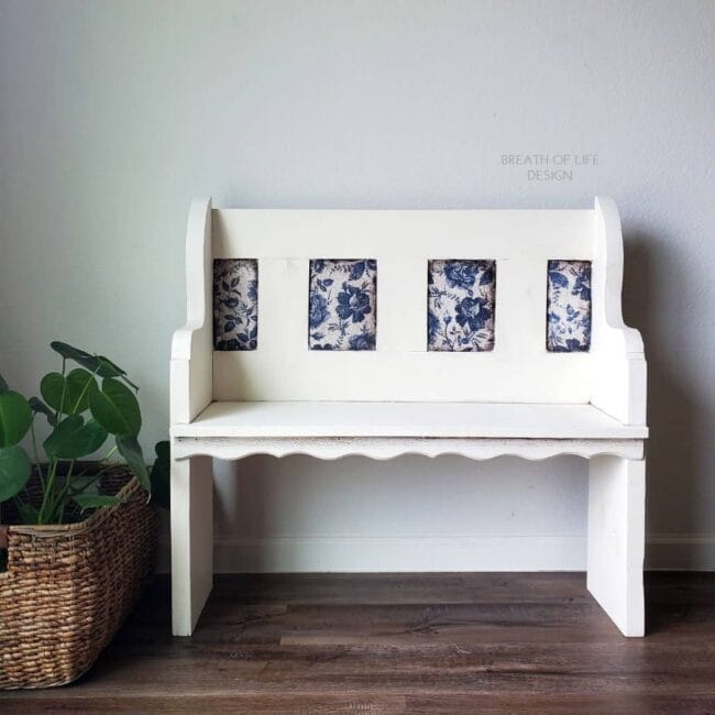 white bench with blue and white floral rice paper inside the squares on the back of the bench