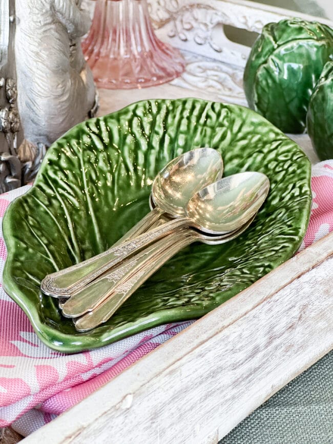 Green leaf dish with silver spoons