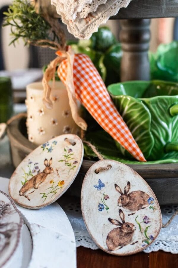 vintage wooden eggs with a fabric carrot sitting by a cabbage bowl